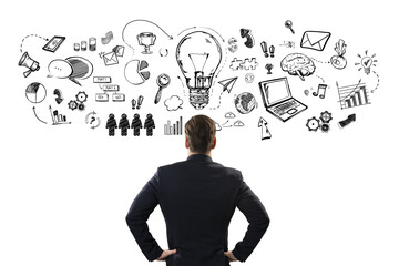 A businessman facing a whiteboard with creative doodles sketching ideas and innovation on white background