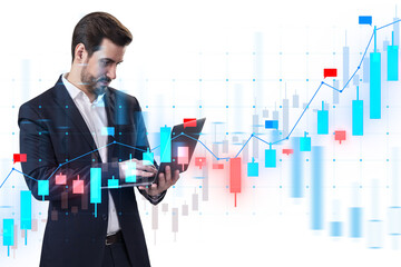 A businessman analyzing digital financial charts on a tablet, with graphical data overlay on white background, concept of market analysis