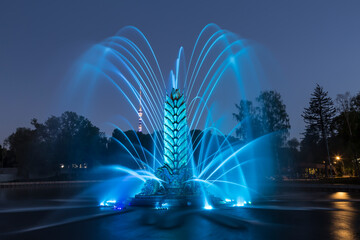 Fountain "Zolotoy Kolos" ("Golden spike") on the territory of the All-Russian exhibition center (VDNH) in the evening. Moscow, Russia