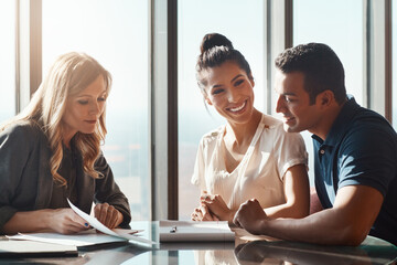 Couple, paperwork and advice with investment advisor for financial planning, compliance and agreement. Office, consultant and married people with document for budgeting, saving and future goals