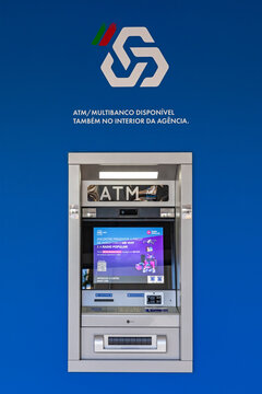 Vila Nova de Famalicao, Portugal - December 23, 2023: Multibanco aka ATM machine terminal managed by SIBS, with brand logo, sign or symbol of CGD aka Caixa Geral de Depositos on a bank agency