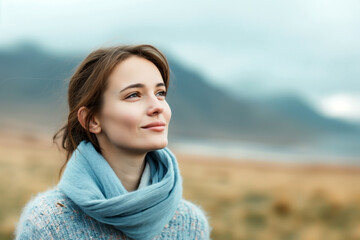 A content woman looks up with a smile, embracing the tranquillity of the natural surroundings.