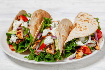 grilled chicken street tacos on a white plate