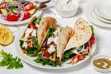 grilled chicken street tacos on a white plate