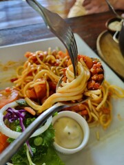 Italian pasta spaghetti with pork in white plate