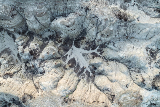 Aerial View of Intricate Erosion Patterns in Bisti Badlands - Powered by Adobe