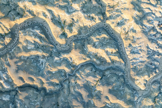 Aerial view of sinuous patterns in Bisti Badlands