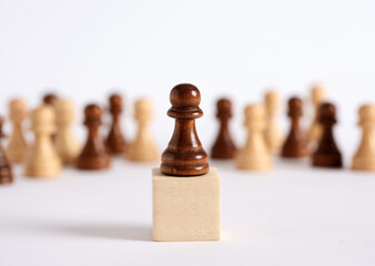 Chess pawn on the rostrum gives a speech to the crowded audience.