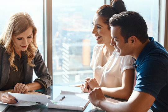 Meeting, couple and financial advisor with paperwork for consulting, insurance plan or investment in office. Advice, help and woman broker with people for discussion, loan application or information