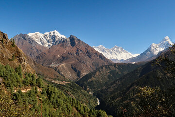 Naklejka premium View onto the peaks of Taboche, Everest, Lhotse and Ama Dablam, in the foreground the villages of Tashinga, Phungi Thenga, Phortse and Tengboche, Tangboche, Mount Everest Base Camp Trek, EBC, Nepal