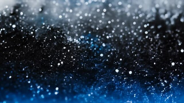 Sparkling blue, gold and white glitter particles in close-up view
