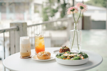 Healthy Breakfast with Juice and Salad on a Balcony Table