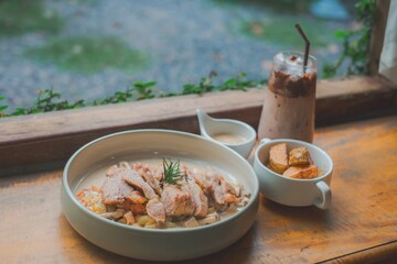 Delicious herb-crusted lamb chops with a side of fresh green vegetables for a healthy and flavorful summer meal