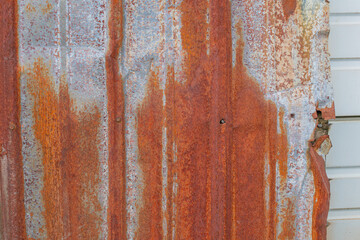 Copy space background image of rusted sheet metal wall, industrial theme background