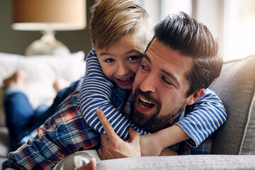 Father, child and hug in home for bonding with family, learning and development for youth wellness. Dad, son and happiness in house with love and care relationship, embrace on sofa to relax together