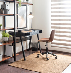 Modern Mid Century home office setup, a sleek black desk paired, stylish leather office chair. The workspace is enhanced with floating wooden shelves filled with green plants and minimalist decor.