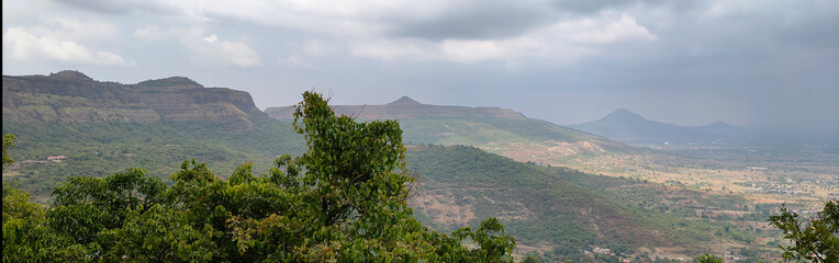 Mahararashtra forts Panaroma Mountains and cloudy monsoon weather beautiful scenic beauty during monsoon Heritage site historical place in maharashtra