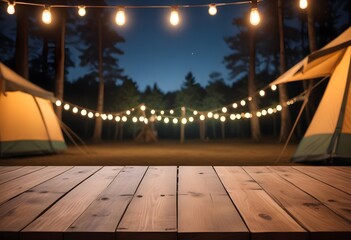 Wooden table top on blur tent camping travel tent at night.Drink and party concept.For montage product display or design key visual layout.View of copy space.

