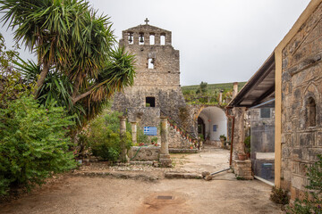 Great typical Greek monastery walls. Ruins in the Mediterranean architectural style of Greece. Sunset on 
Anafonitria monastery, Ionian Islands, Greece