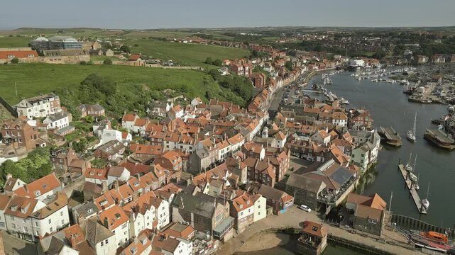 River Esk and Whitby Old Town buildings, North Yorkshire, England