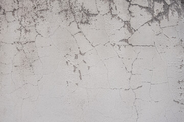 abstract background of an old shabby painted white wall close up