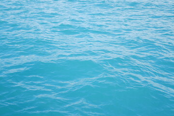 Blue sea water background. Texture of sea water surface with waves.
