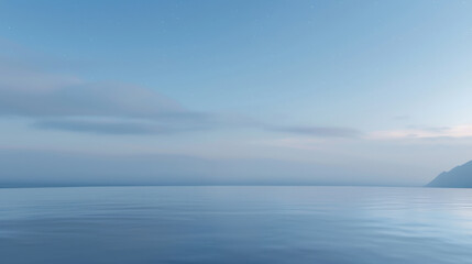 Obraz premium A calm, clear blue ocean with a few clouds in the sky