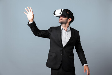 Project manager with virtual reality glasses looking at data analysis while analyzing and pointing...
