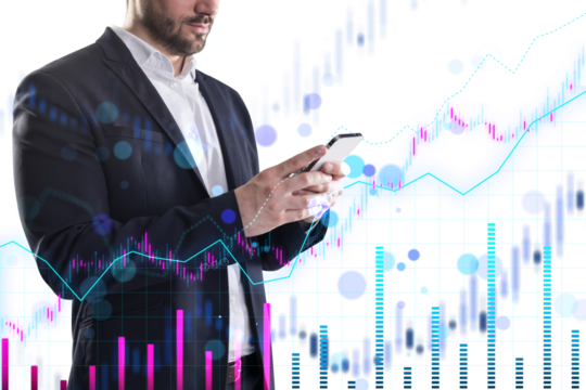 A businessman using a smartphone with financial charts overlaid in the background, representing analytics and technology