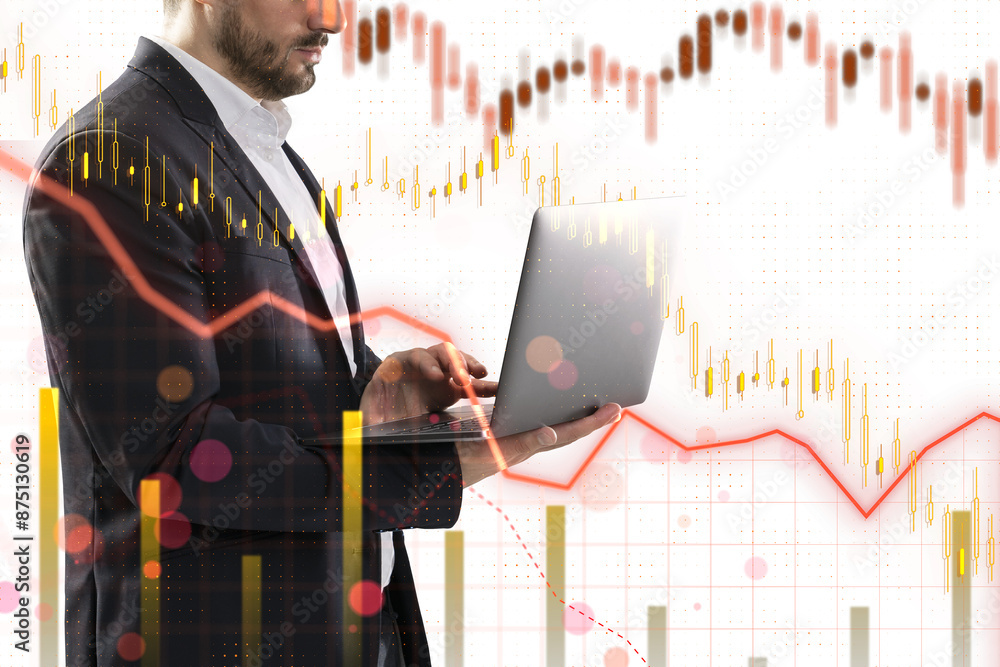 Poster a businessman using a laptop with overlaid financial graphs and data, symbolizing market analysis on