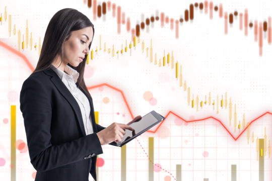A professional businesswoman holding a digital tablet, against a background with financial charts and graphs symbols