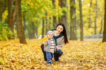 Mother and child in autumn park