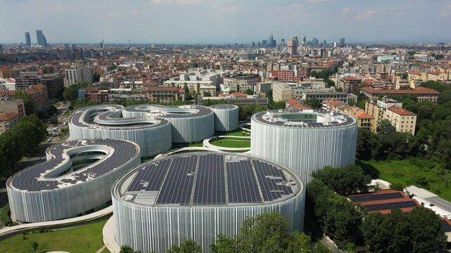 Aerial view of solar panels on the roof. The new SDA Bocconi campus,School of Management. Modern building with classrooms. Green revolution  Ecological energy. Milan Skyline , Italy Europe