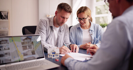 Happy Hispanic Real Estate Agent Shows House to Young Latinx Couple on Laptop