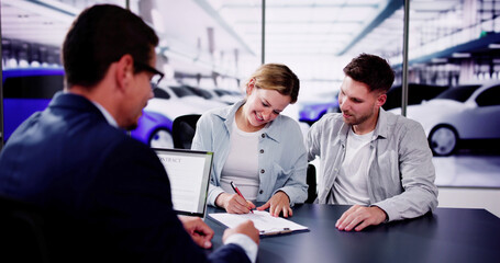 Hispanic Executive Closing Sale with Happy Couple