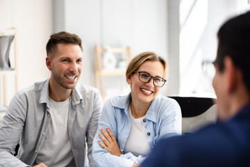 Financial Advisor Consults with Young Couple About Future Investments