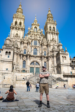 Man pilgrim in front of the Santiago de Compostela Cathedral