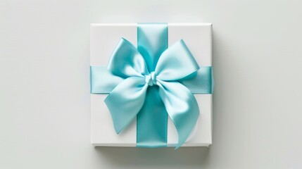 Small white gift box with a light blue ribbon.
