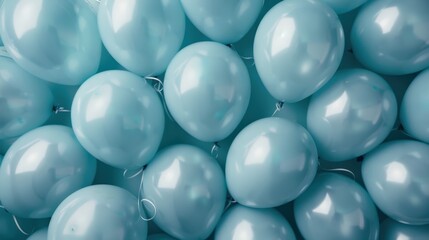 Spread of teal balloons scattered across a surface to create a cheerful and festive environment, symbolizing celebration and joyous occasions.