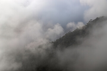 mountain range valley filled with low clouds with dramatic sky at morning image is taken at nongriat cherrapunjee meghalaya india.