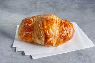A view of a plain croissant.