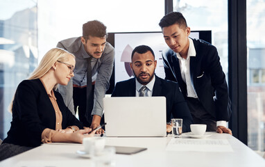 Business, employees and laptop in office with presentation for strategy on project proposal and ideas. Diversity, people and smile at boardroom for teamwork or collaboration with report and feedback