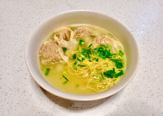traditional famous authentic hong kong chinese dumpling wonton noodle soup street food stall in local restaurant at kowloon tsim sha tsui hong kong