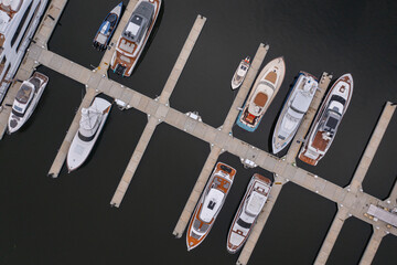 Aerial overview of luxury docked yachts.