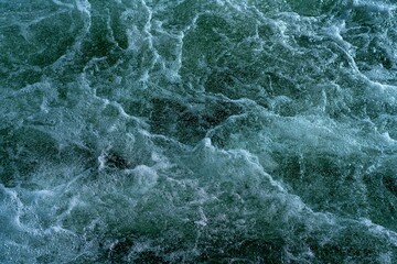 Foaming water after a waterfall.