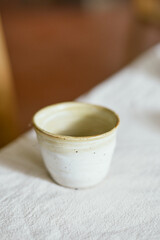 Ceramic cup on a textile