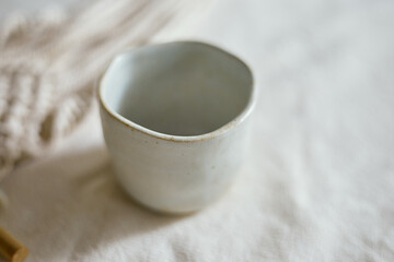 Ceramic cup on a textile