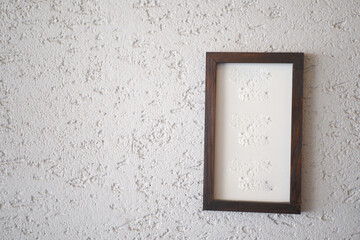 Minimalist framed artwork on textured wall, adding aesthetic and artistic touch