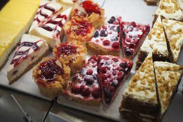 An array of baked goods, including pastries, is showcased in the bakery