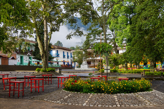 Parque principal : main square of Jardin, Jard&iacute;n, with a beautiful morning light. Green trees. Antioquia, Colombia.